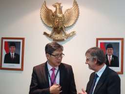 Prof. Noor, a geneticist, talks with Prof. Pickering, a political historian