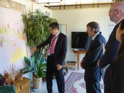 Prof. Noor shows guests a map of Indonesia and northern Australia