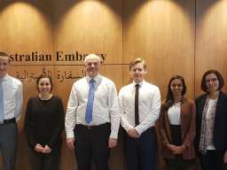 ANU debating team stands with Australia's Ambassador to Qatar, Axel Wabenhorst, at the Australian Embassy in Doha. Image: @AusAmbQatar/Twitter