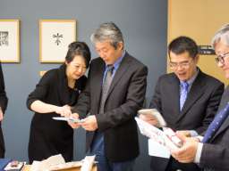 (L-R) Prof. Jacqueline Lo, Nanjing's Dr Fan Ke and Prof. Wu Yuxiao exchange gifts