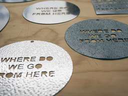 "This is the main image of the festival, a round disc with text saw pierced/cut out. The text for this piece comes directly from the opening speech by Sir John Eccles, on 6th May 1959 at the lunch of the Academy of Sciences," says Zoe. Image: Nerio Communications
