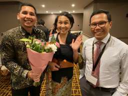 Photo supplied by Emeritus Professor Terence Hull. From left to right: Dr Suharti's son, Fauzi; Dr Suharti; and her colleague Pungkas Ali