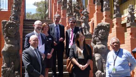  ANU and Indonesian embassy officials among Balinese statues at the Indonesian embassy, Canberra. Image: Wahono
 