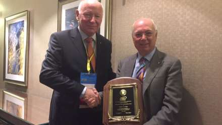  Professor Podger AO (right) with his award "for his work on a global scale to strengthen the public sector and understanding of public service". 