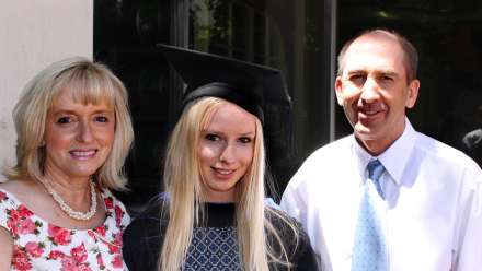  Chelsea with her parents at graduation. Photo via Faces of ANU/Facebook
 