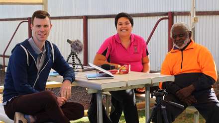 Linguists James Bednall and Rosie Sitorus with Gami Ollie George. Image: Bundiyarra-Irra Wangga Language Centre. 
 