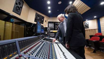  ANU Vice-Chancellor Professor Brian Schmidt AC pressing the record button on the new Neve console, accompanied by the School's Music Technology Convenor Associate Professor Samantha Bennett. Image: Stuart Hay
 