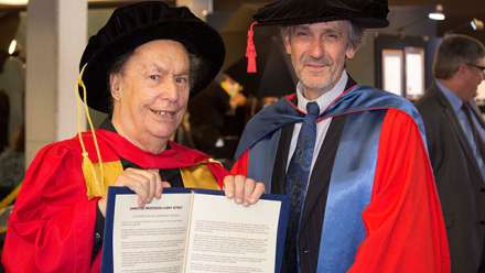  Emeritus Professor Larry Sitsky shows off his Honorary Degree with CASS Dean Professor Paul Pickering.
 