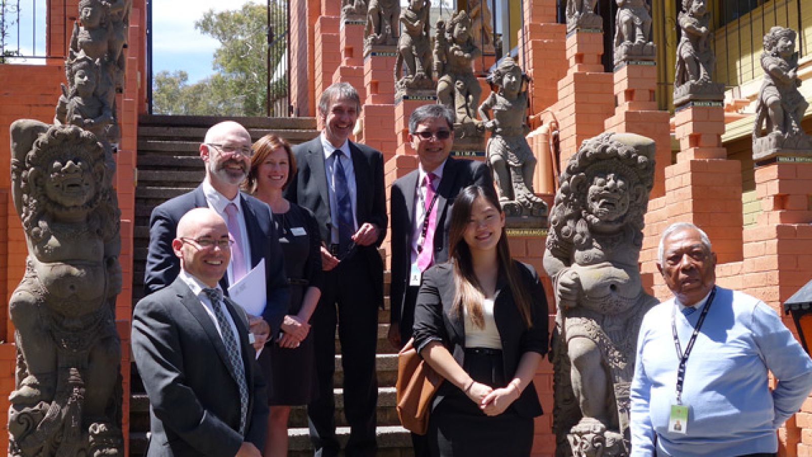ANU and Indonesian embassy officials among Balinese statues at the Indonesian embassy, Canberra. Image: Wahono