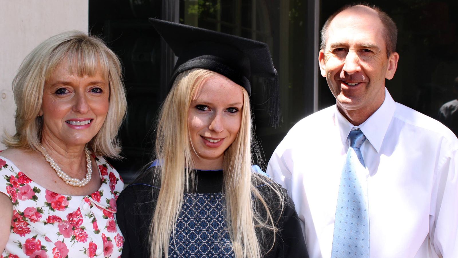 Chelsea with her parents at graduation. Photo via Faces of ANU/Facebook