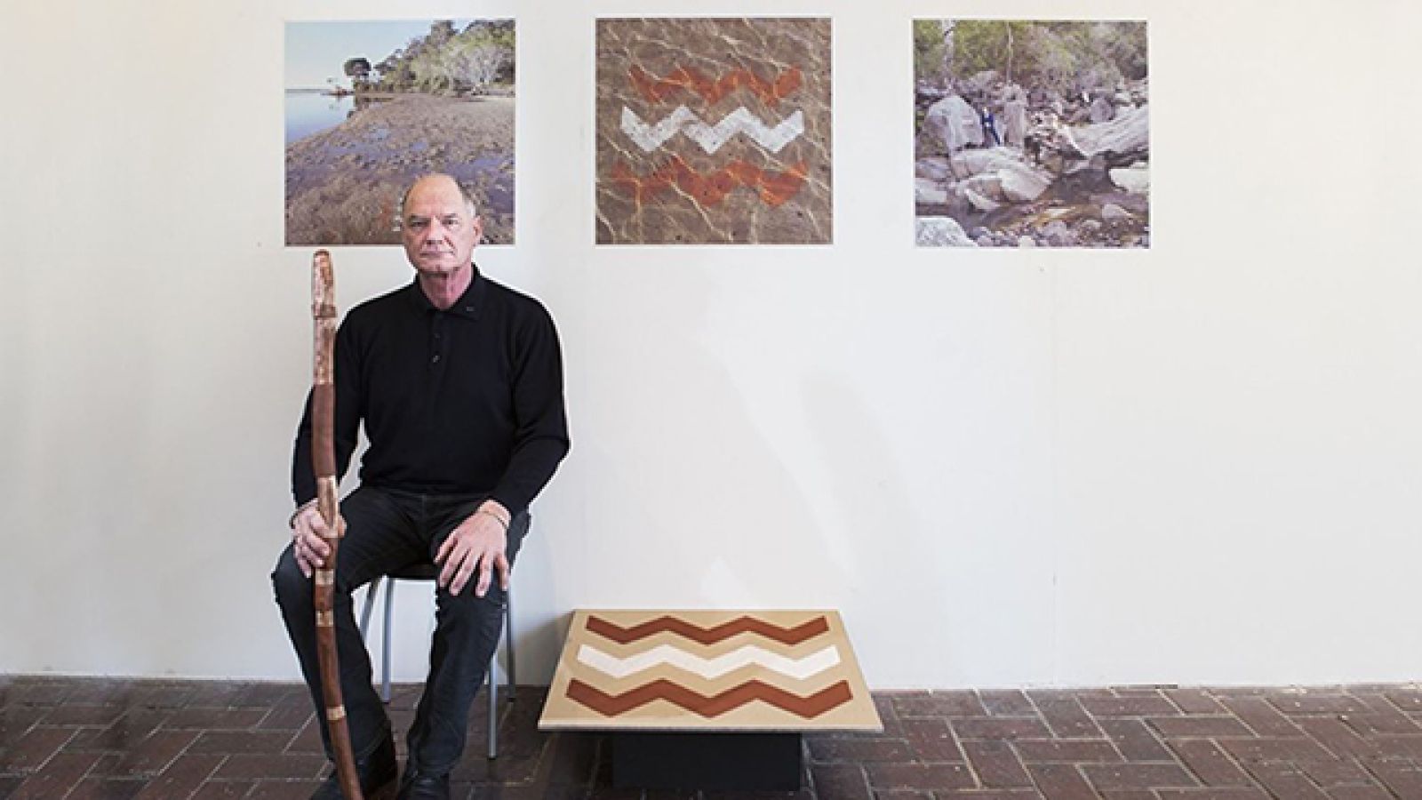 ANU School of Art Masters student Harijs Piekalns and his work 'The Source of the Towamba River and Kiah Inlet: A Different Flow'. Photo by Stuart Hay.