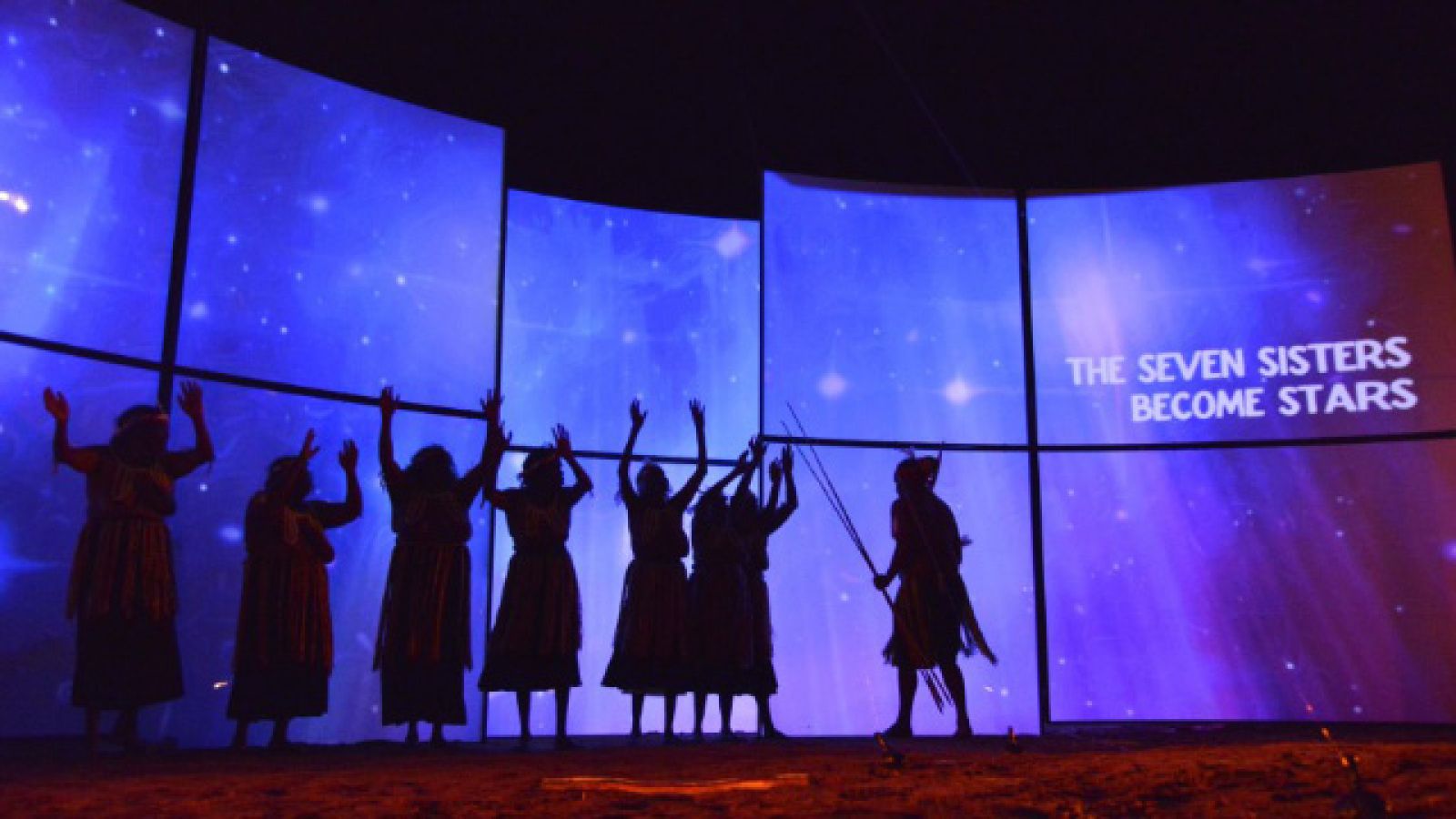 The Kungkarangkalpa Seven Sisters fly up to become the Pleiades in the night sky, performance at the NMA, March 2013. Photo: Wayne Quilliam, courtesy of Songlines of the Western Desert ARC Project and presenting partner the Centenary of Canberra.